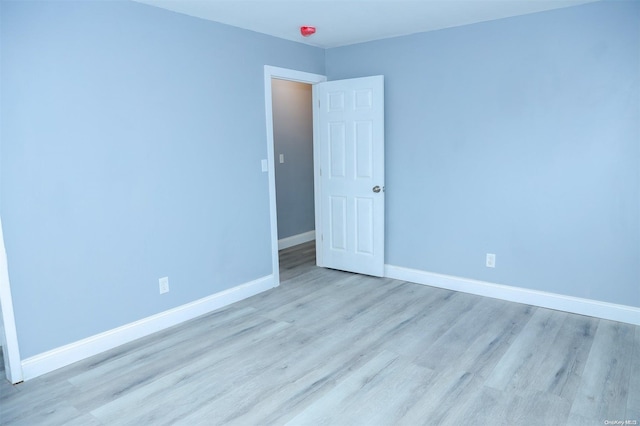 spare room featuring light hardwood / wood-style flooring