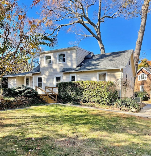 exterior space featuring a lawn and a deck