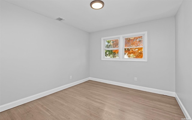 spare room with light hardwood / wood-style floors