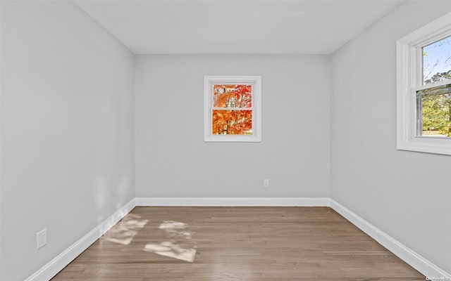 unfurnished room with light hardwood / wood-style flooring