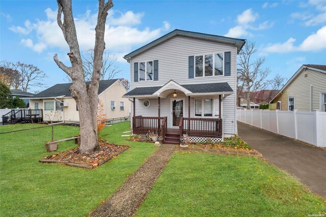 43 2nd St, Ronkonkoma, NY 11779 - traditional-style home with a porch
