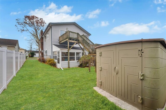 43 2nd St, Ronkonkoma, NY 11779 - rear view of property featuring a balcony and a sunroom