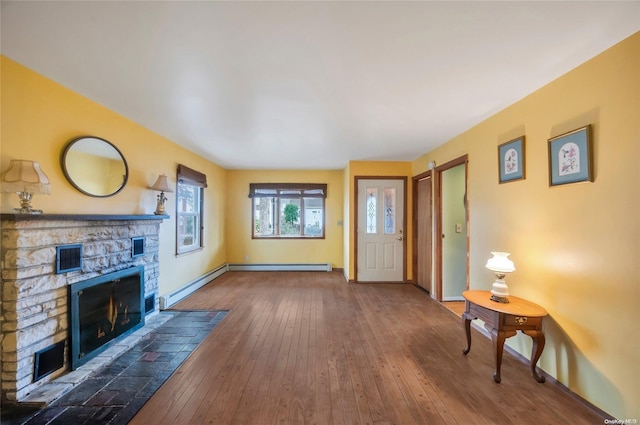 43 2nd St, Ronkonkoma, NY 11779 - entrance foyer with a fireplace, baseboards, a baseboard radiator, and hardwood / wood-style floors