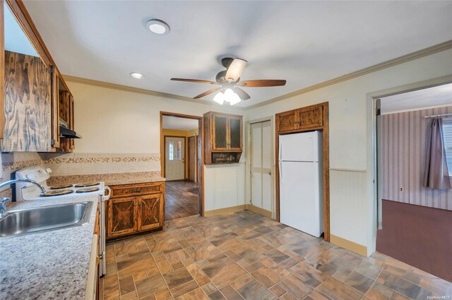 43 2nd St, Ronkonkoma, NY 11779 - kitchen with freestanding refrigerator, a sink, ceiling fan, under cabinet range hood, and light countertops
