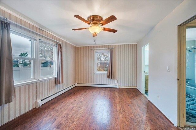 43 2nd St, Ronkonkoma, NY 11779 - empty room with wood finished floors, healthy amount of natural light, ceiling fan, and wallpapered walls