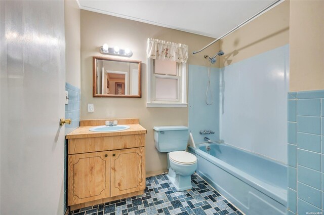 43 2nd St, Ronkonkoma, NY 11779 - bathroom with washtub / shower combination, toilet, and vanity