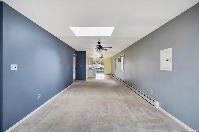 43 2nd St, Ronkonkoma, NY 11779 - unfurnished living room featuring a skylight, carpet flooring, a ceiling fan, baseboards, and electric panel