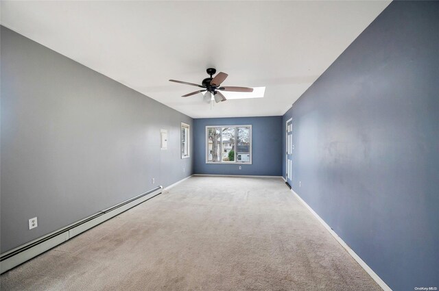 43 2nd St, Ronkonkoma, NY 11779 - empty room featuring baseboard heating, a ceiling fan, carpet flooring, and baseboards