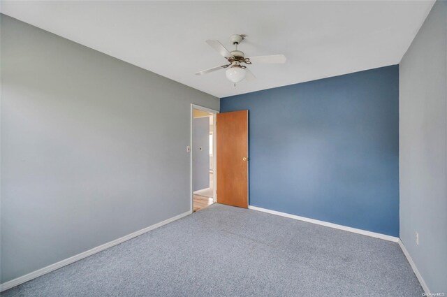 43 2nd St, Ronkonkoma, NY 11779 - carpeted spare room with a ceiling fan and baseboards