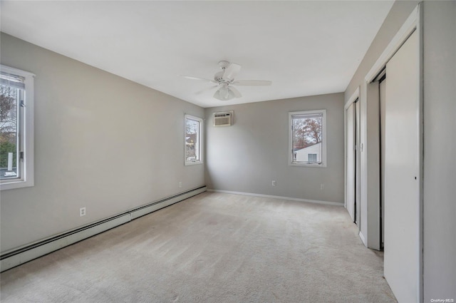 43 2nd St, Ronkonkoma, NY 11779 - unfurnished bedroom with a baseboard heating unit, multiple windows, and light colored carpet