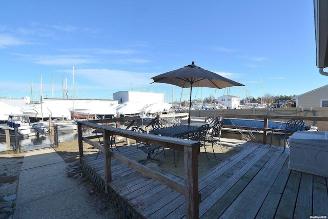 wooden deck featuring a water view