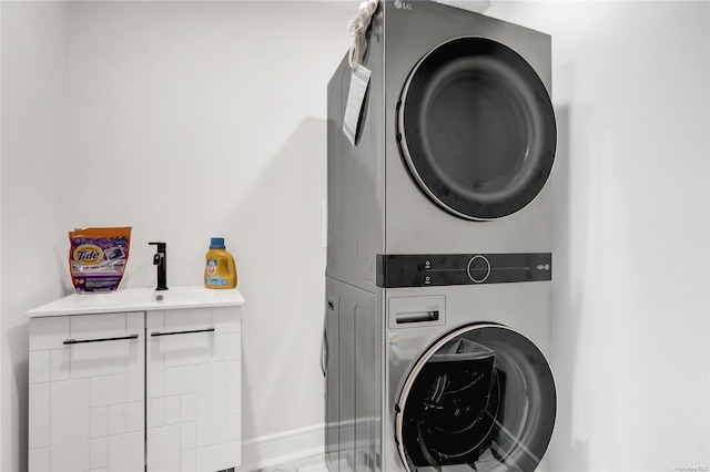 washroom with stacked washer / drying machine