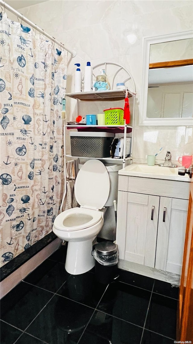 bathroom with tile patterned floors, curtained shower, and toilet