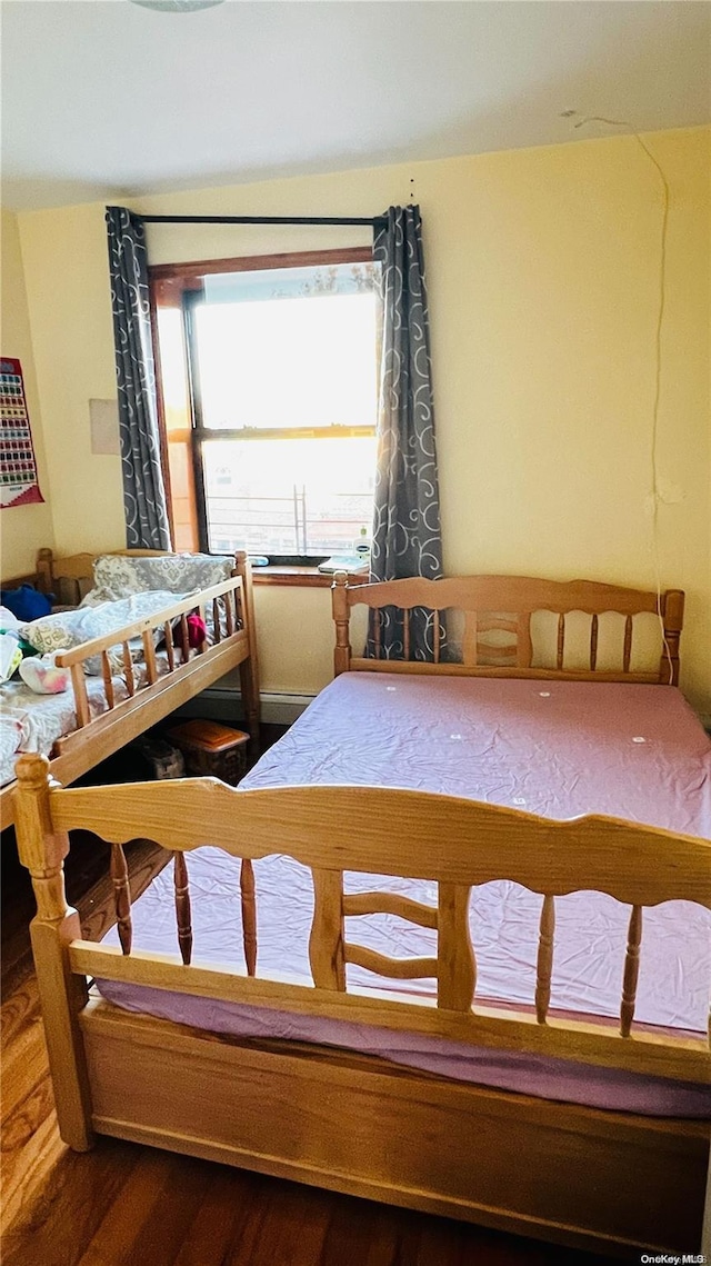 bedroom with hardwood / wood-style flooring