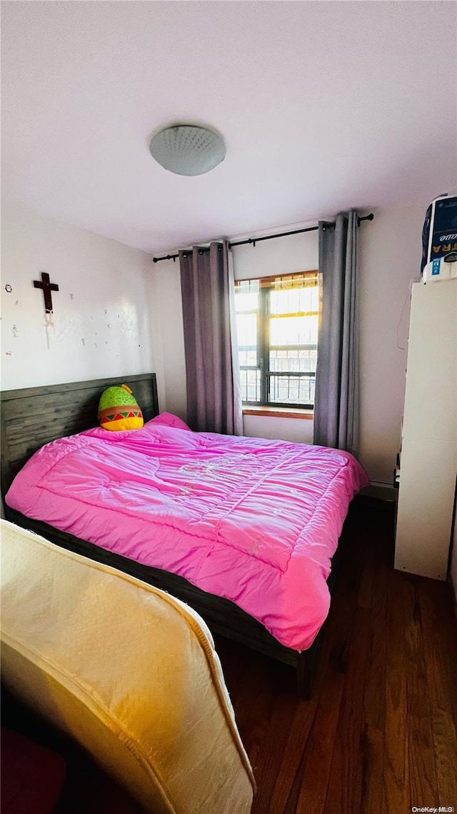 bedroom featuring dark hardwood / wood-style floors