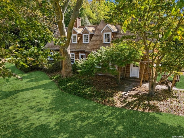 1117 Cedar Ln, East Marion, NY 11939 - view of front of property featuring a chimney and a front yard