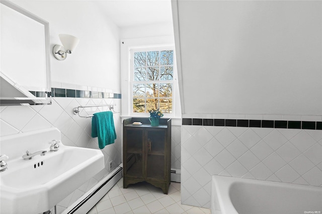 bathroom featuring tile patterned flooring, a baseboard radiator, and tile walls