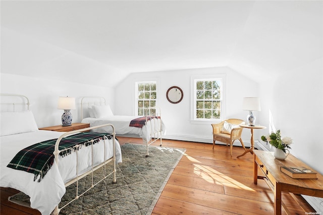 1117 Cedar Ln, East Marion, NY 11939 - bedroom featuring lofted ceiling and wood-type flooring