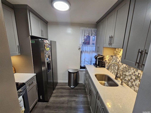 kitchen featuring stainless steel fridge, range with electric cooktop, gray cabinetry, sink, and dark hardwood / wood-style floors