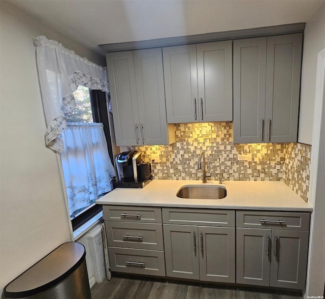 kitchen featuring gray cabinets, dark hardwood / wood-style flooring, and sink