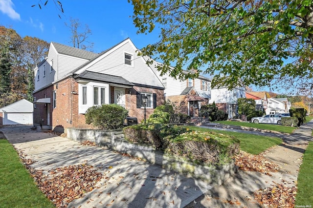 view of front of house with an outbuilding and a garage