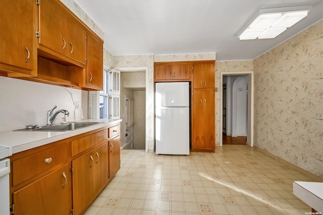 kitchen featuring sink and white refrigerator