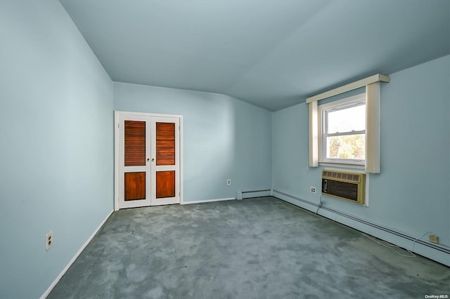 interior space with french doors, vaulted ceiling, carpet flooring, a baseboard radiator, and a wall unit AC