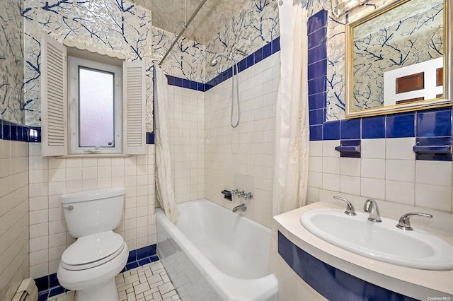 full bathroom with shower / bath combination with curtain, a baseboard radiator, tile walls, and sink