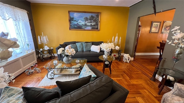 living room featuring radiator and parquet floors