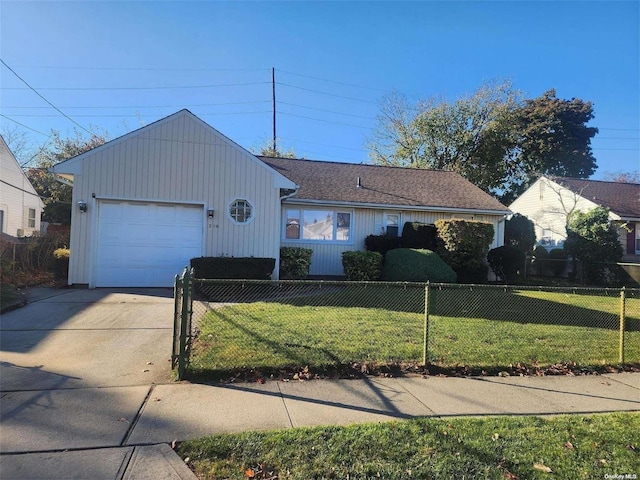 ranch-style house with driveway, a fenced front yard, and a front lawn