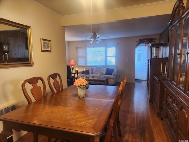 dining area with radiator, crown molding, dark wood-style flooring, and ceiling fan