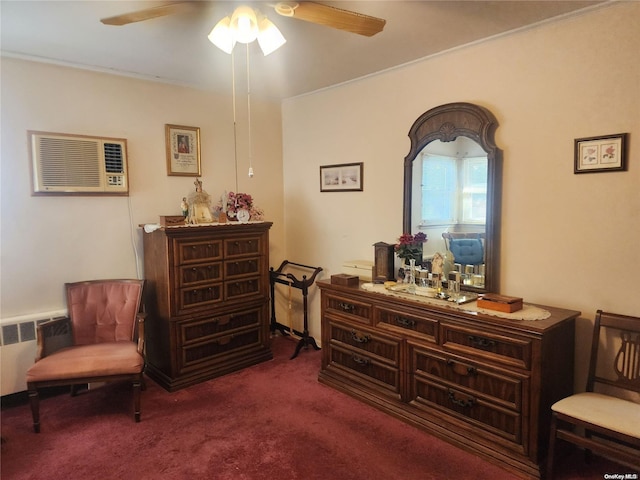 sitting room featuring radiator, carpet floors, and a ceiling fan