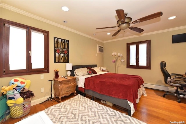 bedroom featuring baseboard heating, ceiling fan, ornamental molding, and hardwood / wood-style flooring