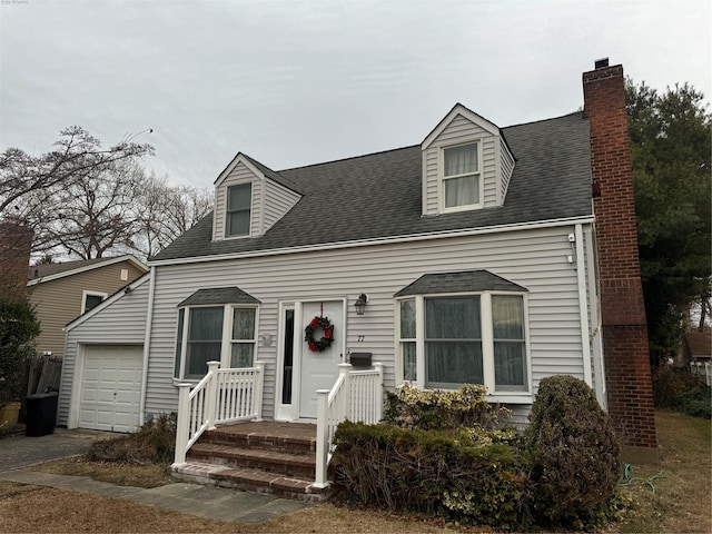 cape cod house with a garage