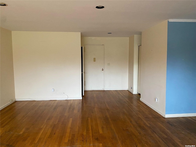 spare room featuring dark hardwood / wood-style floors