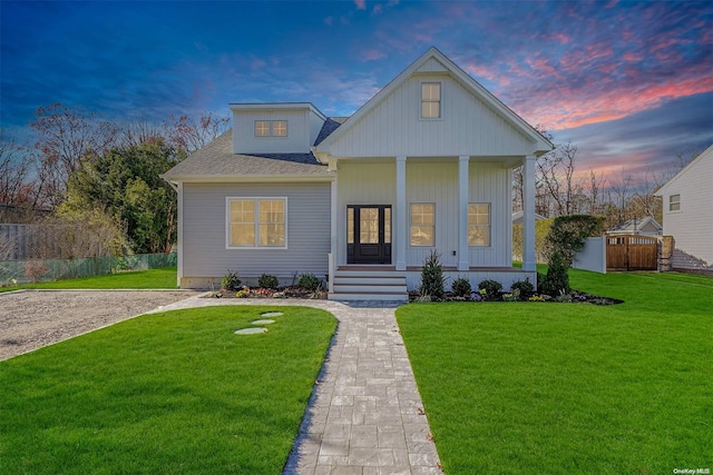 view of front facade featuring a lawn and a porch