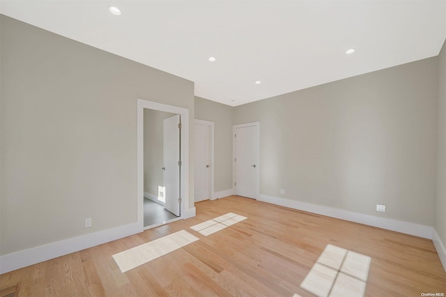 spare room featuring light hardwood / wood-style floors