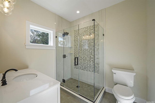 bathroom featuring walk in shower, vanity, and toilet