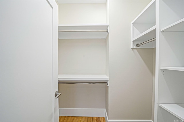 walk in closet featuring light hardwood / wood-style floors