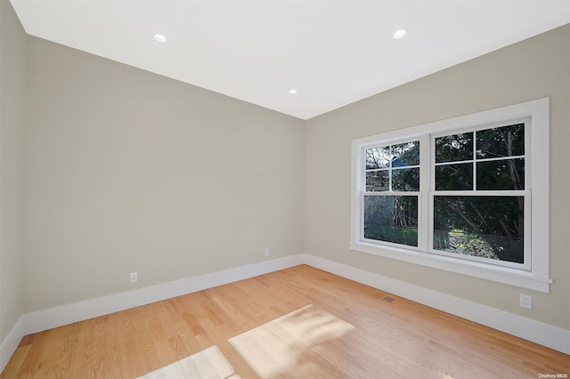 unfurnished room featuring wood-type flooring