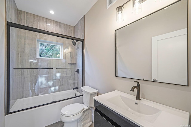 full bathroom with toilet, vanity, and combined bath / shower with glass door