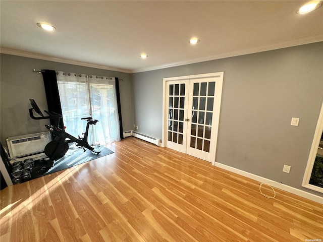 workout area featuring french doors, ornamental molding, baseboard heating, light hardwood / wood-style floors, and a wall unit AC