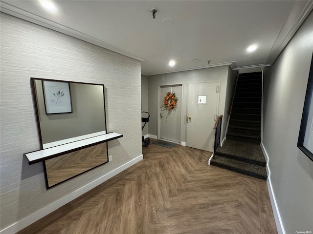 entryway featuring parquet flooring and ornamental molding