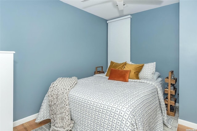 bedroom featuring ceiling fan and light wood-type flooring