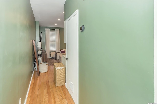 corridor with light wood-type flooring