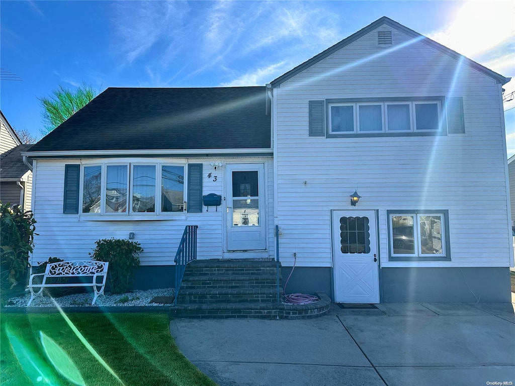 43 Jefferson St, Freeport, NY 11520 - view of front of house featuring a patio and roof with shingles