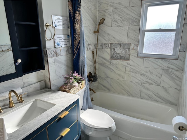 full bathroom with shower / tub combo, vanity, and toilet