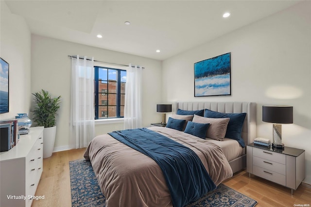 bedroom with light hardwood / wood-style floors