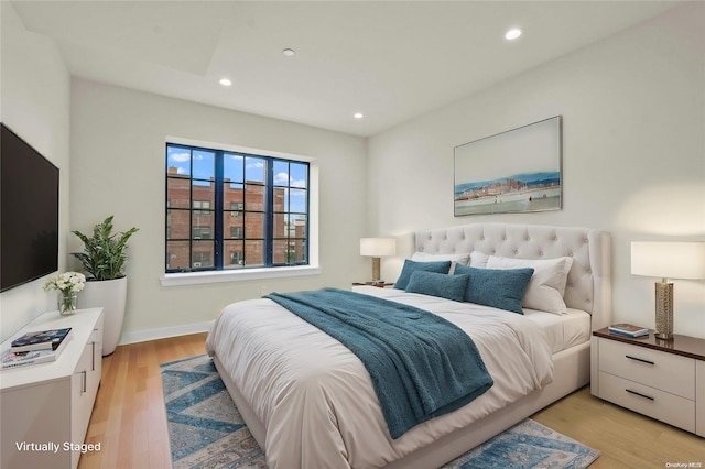 bedroom with light hardwood / wood-style floors