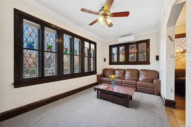 carpeted living room with crown molding, a wealth of natural light, and a wall mounted AC